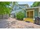 Charming home exterior with brick paved walkway and lush landscaping at 1825 2Nd S St, St Petersburg, FL 33705