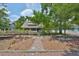 Charming home exterior featuring a brick path and beautifully landscaped front yard at 1825 2Nd S St, St Petersburg, FL 33705