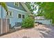 Exterior home shot with brick pavers, showing AC unit and access to back cottage unit at 1825 2Nd S St, St Petersburg, FL 33705