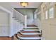 Elegant foyer features beautiful hardwood floors and a classic staircase design at 1825 2Nd S St, St Petersburg, FL 33705
