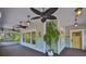 Charming covered porch with ceiling fans, decorative lighting, and space for relaxation at 1825 2Nd S St, St Petersburg, FL 33705