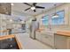 Bright, modern kitchen with stainless steel appliances, custom cabinets, and white hexagon tile flooring at 1825 2Nd S St, St Petersburg, FL 33705