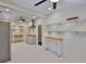 A charming kitchen features stainless steel appliances, custom cabinets and floating shelves with wooden countertop at 1825 2Nd S St, St Petersburg, FL 33705