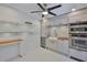 Kitchen with custom cabinets, stainless steel appliances, double ovens, butcher block counters, and stylish tile flooring at 1825 2Nd S St, St Petersburg, FL 33705