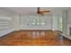 Sun-filled living room with hardwood floors, a fireplace, and a built-in bookcase at 1825 2Nd S St, St Petersburg, FL 33705
