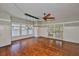 Spacious living room with hardwood floors, lots of natural light, and stylish lighting fixtures at 1825 2Nd S St, St Petersburg, FL 33705