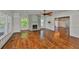 Inviting living room featuring a brick fireplace, large windows, and hardwood floors at 1825 2Nd S St, St Petersburg, FL 33705