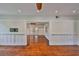 Spacious living room with hardwood floors, wainscoting, and neutral paint, awaiting your personal touch at 1825 2Nd S St, St Petersburg, FL 33705