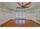 Charming living room with hardwood floors, bright windows, modern lighting, and inviting atmosphere at 1825 2Nd S St, St Petersburg, FL 33705