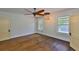 A spacious bedroom with hardwood floors, plenty of natural light, and modern light fixtures offers space and style at 1825 2Nd S St, St Petersburg, FL 33705