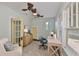 Cozy office featuring a ceiling fan, natural light, desk, and sitting area at 1825 2Nd S St, St Petersburg, FL 33705