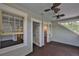 A spacious porch featuring shingle style walls, dark floors and lots of light at 1825 2Nd S St, St Petersburg, FL 33705