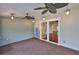 Covered porch with ceiling fans and view to other room, perfect for relaxing outdoors at 1825 2Nd S St, St Petersburg, FL 33705