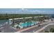 Aerial view featuring a pool, waterfront access, and ample parking at 18400 Gulf Blvd # 2505, Indian Shores, FL 33785