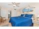 Bright bedroom featuring a king bed, beach mural and connecting door to bathroom with tile flooring at 18400 Gulf Blvd # 2505, Indian Shores, FL 33785