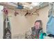 Walk in closet containing wire shelving, sundry household items and baby supplies at 18400 Gulf Blvd # 2505, Indian Shores, FL 33785