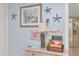 Entryway with gray table, lamp, decorations, and beachy theme at 18400 Gulf Blvd # 2505, Indian Shores, FL 33785