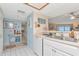 Bright kitchen featuring stainless steel sink and white cabinets at 18400 Gulf Blvd # 2505, Indian Shores, FL 33785