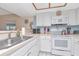 Kitchen with white countertops, appliances, and plenty of storage space at 18400 Gulf Blvd # 2505, Indian Shores, FL 33785