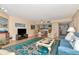 Open-concept living room with a fireplace and views of the ocean at 18400 Gulf Blvd # 2505, Indian Shores, FL 33785