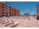 Resort-style pool area offers a relaxing retreat with lounge chairs and sunny skies at 18400 Gulf Blvd # 2505, Indian Shores, FL 33785
