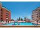 Community swimming pool featuring building views, beach access, and lots of sunshine at 18400 Gulf Blvd # 2505, Indian Shores, FL 33785
