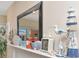 Shelf decor and seaside accents on fireplace at 18400 Gulf Blvd # 2505, Indian Shores, FL 33785