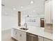 Modern kitchen featuring a view to the living space and stainless steel appliances at 2016 Cove Dr, Largo, FL 33774