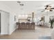 Open kitchen and dining area with pendant lighting, stainless steel appliances, and breakfast bar seating at 2016 Cove Dr, Largo, FL 33774