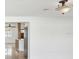 Bright living room featuring hardwood flooring, and a view of the modern kitchen at 2016 Cove Dr, Largo, FL 33774
