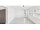 Bright, open space featuring tile floors, white walls, and natural light from windows and doors at 2016 Cove Dr, Largo, FL 33774