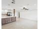 Spacious open-concept space with modern lighting, tile floors, and stylish ceiling fan at 2016 Cove Dr, Largo, FL 33774
