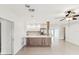 Beautiful open floor plan featuring tile floors and a kitchen with stainless steel appliances at 2016 Cove Dr, Largo, FL 33774