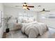 Serene main bedroom features two ceiling fans, ensuite bathroom, and plantation shutters at 2016 Cove Dr, Largo, FL 33774