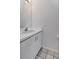 Bathroom featuring white vanity with sink, tiled floor and white walls at 2120 S Hesperides St, Tampa, FL 33629