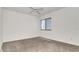 Simple room featuring neutral carpet, white walls, and bright window at 2120 S Hesperides St, Tampa, FL 33629