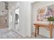 Bright foyer featuring tile flooring and a decorative wooden table with an artistic painting at 2120 S Hesperides St, Tampa, FL 33629