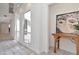 Hallway featuring tiled floor, bright windows, and framed art at 2120 S Hesperides St, Tampa, FL 33629