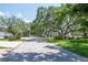 Peaceful street with mature trees and lush green lawns at 2120 S Hesperides St, Tampa, FL 33629