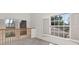 Upstairs landing area with multiple windows and natural lighting at 2120 S Hesperides St, Tampa, FL 33629