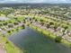 Gorgeous aerial view of homes in a golf community, surrounded by lush fairways and lakes at 2218 Brookfield Greens Cir # 82, Sun City Center, FL 33573
