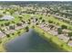 Overhead view highlighting the golf community homes with access to lush fairways and tranquil lakes at 2218 Brookfield Greens Cir # 82, Sun City Center, FL 33573
