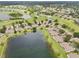 Panoramic aerial showcasing homes nestled amidst lush golf fairways and tranquil lakes at 2218 Brookfield Greens Cir # 82, Sun City Center, FL 33573