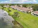 Beautiful waterfront homes offer tranquil living with lush green lawns in a vibrant, active community at 2218 Brookfield Greens Cir # 82, Sun City Center, FL 33573
