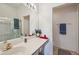 Bright bathroom features a large mirror, ample countertop space, and a shower with glass doors at 2218 Brookfield Greens Cir # 82, Sun City Center, FL 33573
