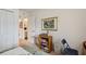 Cozy bedroom with closet, neutral walls, and a view into the bathroom with natural light at 2218 Brookfield Greens Cir # 82, Sun City Center, FL 33573