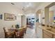 Bright kitchen with a breakfast nook, tile flooring, wood cabinets, and a round glass table with chairs at 2218 Brookfield Greens Cir # 82, Sun City Center, FL 33573