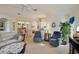 Bright open floor plan between the living room and kitchen with bar seating at 2218 Brookfield Greens Cir # 82, Sun City Center, FL 33573