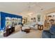 Bright living room with a ceiling fan and views of the outside at 2218 Brookfield Greens Cir # 82, Sun City Center, FL 33573