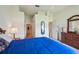 Main bedroom with soft carpet, ceiling fan, and access to closets and ensuite bathroom at 2218 Brookfield Greens Cir # 82, Sun City Center, FL 33573
